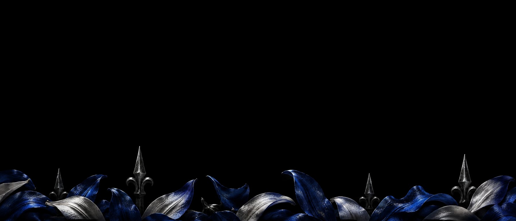 Dormant blue petals and steel blades resting along the ground in the dark.